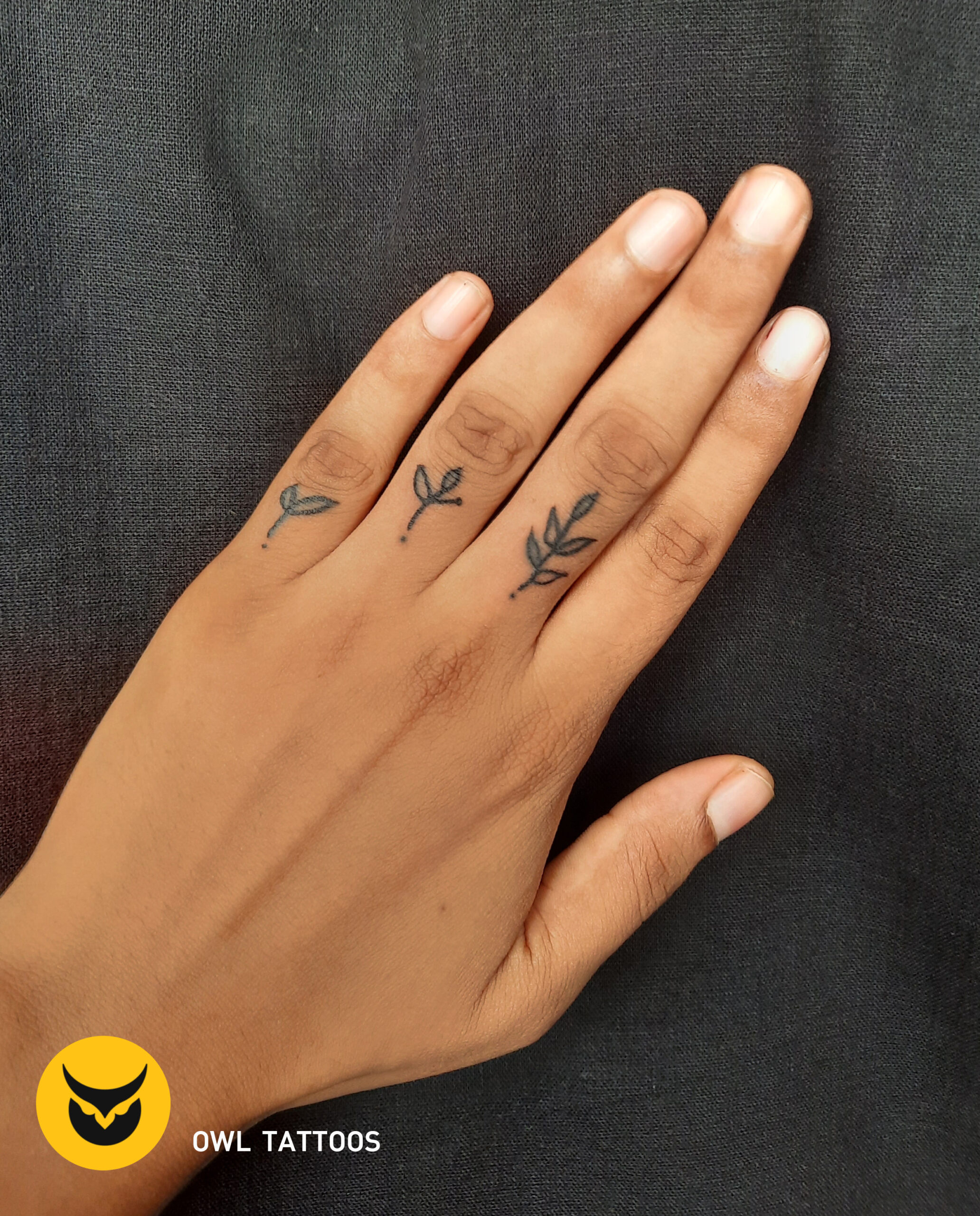 leaves finger tattoo